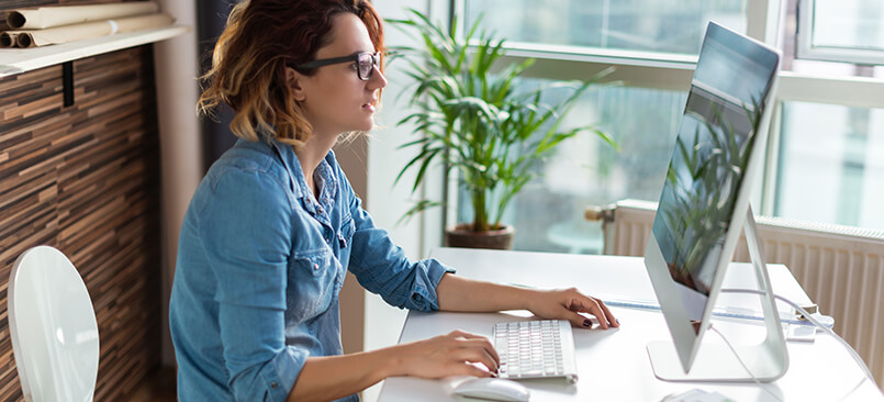 woman at desk working on public engagement branding